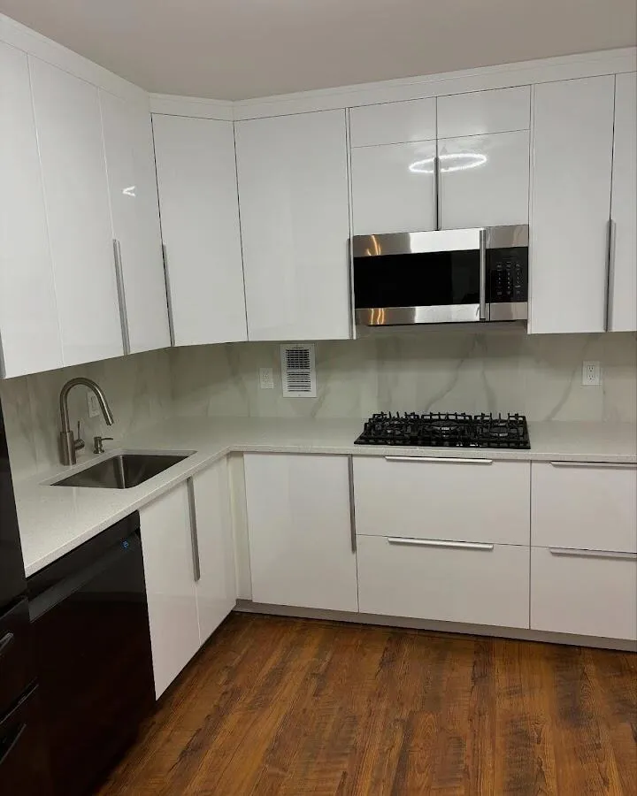 Restored kitchen with white cabinets after water damage in Bridgeport